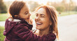 © Strelciuc - Lovely mother and her little girl laughing during a summer walk