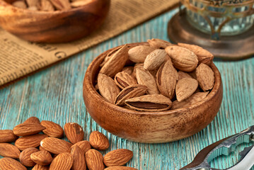 Wall Mural - Almond kernels lie on a dark background.Selective focus.Salted almonds.