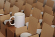 
white mugs in craft cardboard boxes
