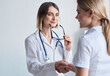 © SHOTPRIME STUDIO - beautiful woman doctor with stethoscope shaking hands with female patient