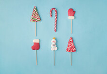 Top Above Overhead Close Up View Photo Of Layout Sweet Traditional Christmas Candies Isolated Over Blue Color Pastel Background