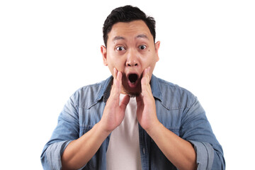 Canvas Print - Portrait of young funny Asian man, gesturing shocked or surprised expression with mouth open