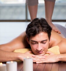 Wall Mural - Young handsome man during spa procedure