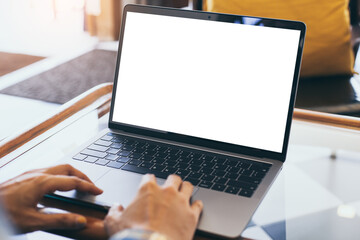 computer blank screen mockup.hand woman work using laptop with white background for advertising,contact business search information on desk at coffee shop.marketing and creative design