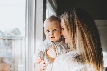 Wall Mural - Young Couple at home Playing with Baby