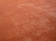 Red clay texture of tennis court. Surface of red sports field