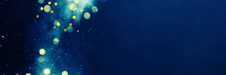 Festive Christmas or New Year blue banner with Christmas lights and snow