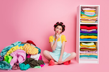 Sticker - Portrait of attractive glamorous minded housemaid sitting on floor in messy untidy room thinking isolated pink pastel color background