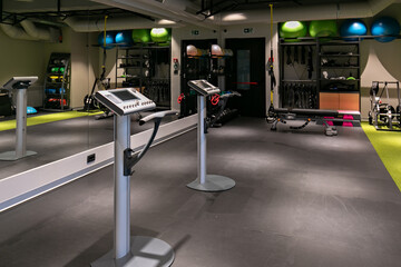 Interior of modern gym with electro stimulation equipment