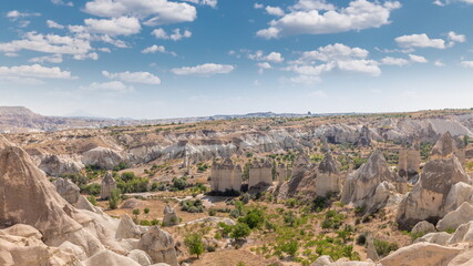 Wall Mural - Red Valley and Rose Valley of Goreme of Nevsehir in Cappadocia aerial timelapse, Turkey.