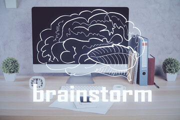 Desktop computer background in office and start up theme hologram drawing. Double exposure. Startup concept.