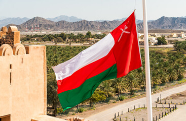 The Oman National Flag on the wall of Jabreen Castle in Bahla in Sultanate of Oman..