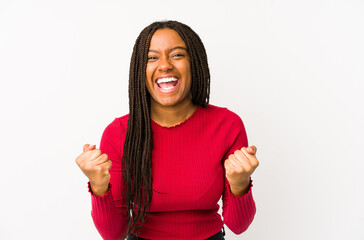 Young african american woman isolated cheering carefree and excited. Victory concept.