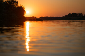 colorful beautiful red sunset over the river