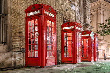 Wall Mural - Famous red telephone booths in the evening, Covent Garden street, London, England