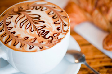 Cappuccino. Fresh cup of dark French roast shot of espresso w/ steamed milk. Classic American. French bistro, coffee house or café beverage. Typical drink served at breakfast. white background