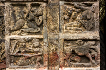 Poster - Naggar, Himachal Pradesh, India - June 2012:  Ancient carvings on the stone walls of an old Hindu temple in the Kullu valley.