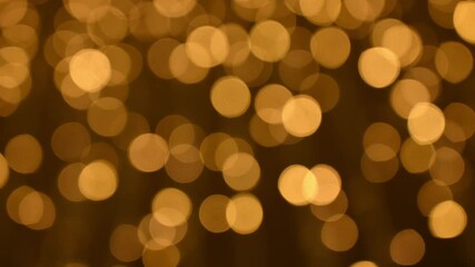 footage 4k b-roll bokeh colorful golden yellow background on black background