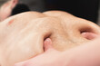 Close-up massage and positioning of the abdomen and internal organs and diaphragm of the abdominal cavity of a man