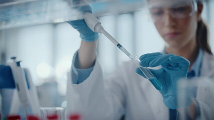 Wall Mural - medical research laboratory: portrait of a beautiful female scientist using micro pipette for analys