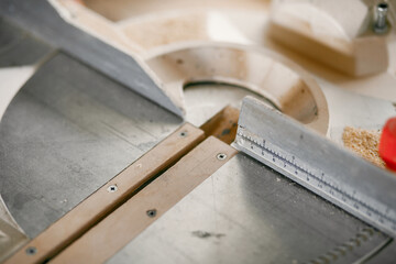 Wall Mural - Craftsman cutting a wooden plank. Worker with wood. Man in a blue shirt.