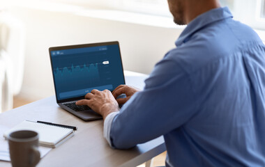 Poster - Businessman Working With Financial Analytics Or Trading Online On Laptop In Office