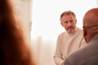 © Monkey Business - Mature Man Attending Support Group Meeting For Mental Health Or Dependency Issues In Community Space
