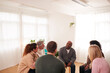 © Monkey Business - People Attending Support Group Meeting For Mental Health Or Dependency Issues In Community Space