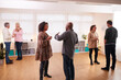 © Monkey Business - Group Of People Drinking Coffee And Chatting At Informal Meeting To Discuss Community Issues