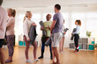 © Monkey Business - People In Exercise Clothing Meeting And Chatting Before Fitness Or Yoga Class In Community Center