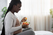 © Prostock-studio - Healthy Diet During Pregnancy. Black Expectant Woman Eating Vegetable Salat At Home