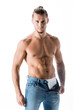 © LIGHTFIELD STUDIOS - shirtless man in jeans posing isolated on white