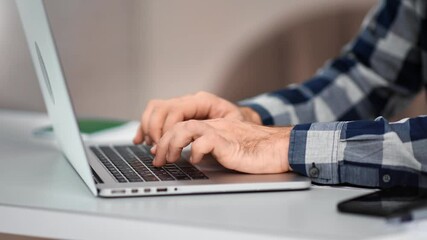 Confident male hands typing press button on keyboard of laptop pc. 4k Dragon RED camera