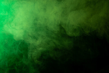Leinwandbilder - Green smoke on black background