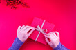 girl opening red christmas gift box in red new year concept