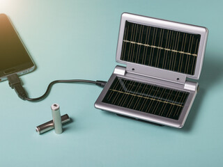 The mobile phone is charged by solar energy. Use of solar energy.