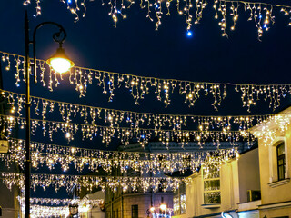 Wall Mural - christmas lights decorations and festive illumination at old street, Minsk, Belarus