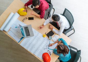 Wall Mural - Three contractor builder team having a successful meeting in office, Top view shot.