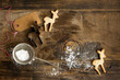 © Foodlovers - Festive Christmas deer shaped biscuits on a rustic board with cookie cutter, icing sugar in sifter and gift label