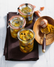 Pickled Curried Courgette In White Wine Vinegar, Peppers And Mustard In Jars