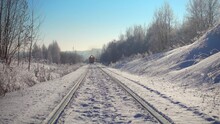 Freight Train Rides In Beautiful Winter Landscape. High Quality 4k Footage.