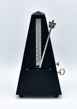 Black Metronome Isolated On A White Background.