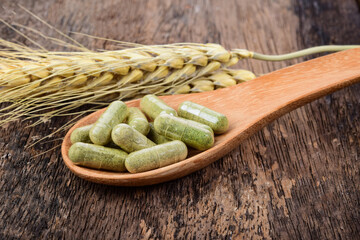 Wall Mural - Moringa powder in wood spoon on wooden