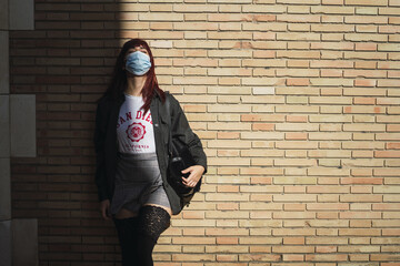 Poster - Selective focus shot of an attractive female posing and wearing a facial mask