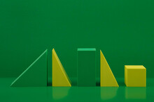 Duotone Still Life With Yellow And Green Geometric Figures On A Green Background With A Space For Text