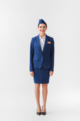 Sticker - Beautiful stewardess on light background