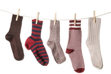Warm Socks Hanging On Clothes Line Against White Background