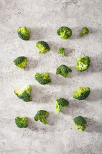Broccoli Florets On A Grey Surface