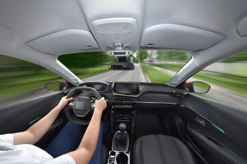 Woman driving a car fast