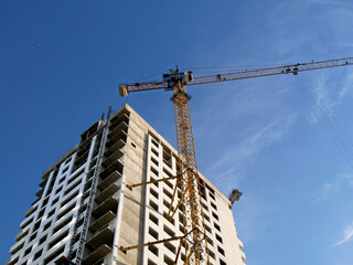 Construction site. Building site with crane. Concrete building under construction